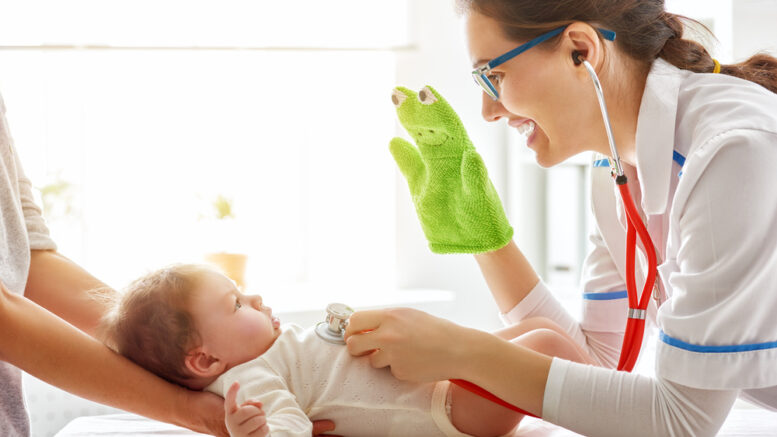 pediatrician with newborn