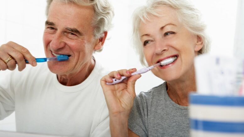 elderly brushing teeth