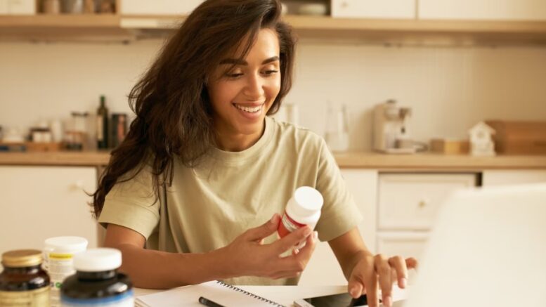 girl with supplements smiling