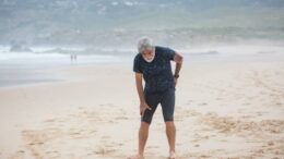 elderly back pain beach