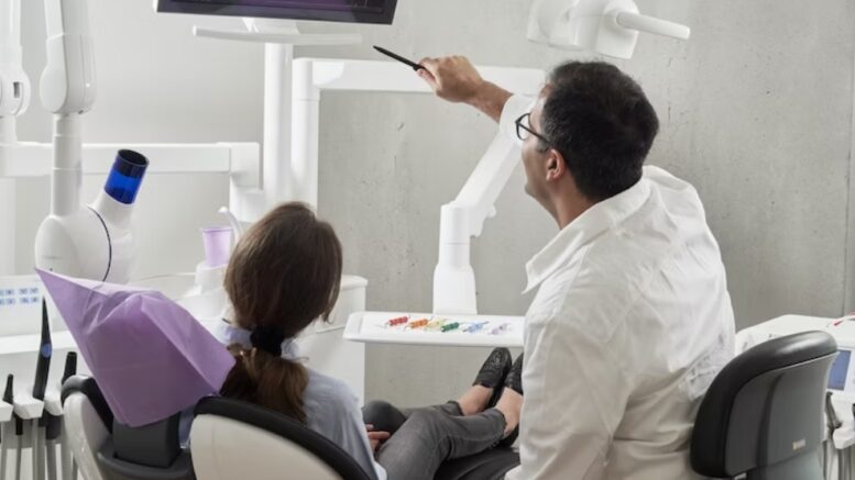 dentist showing x-ray to patient