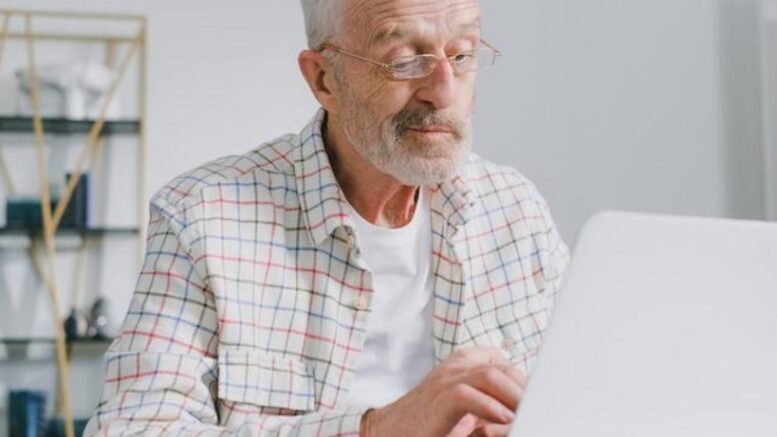 old man at computer