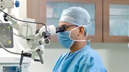 Surgeon watching a microscope