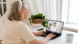 Elderly woman remotely accessing telemedicine